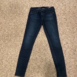 Dark Blue skinny jeans by AG in size 25S.